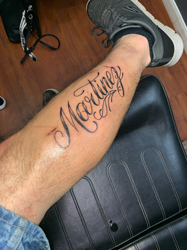 Explore kiss band tattoo ideas, creative tattoo ideas in Dallas, available at 2Xtremes Tattoos & Piercing