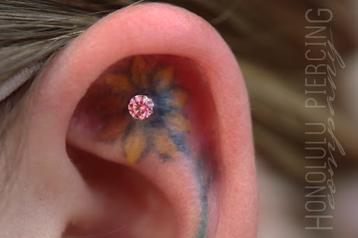 Explore rose hand tattoo ideas, creative tattoo ideas in Honolulu, available at Honolulu Piercing Company at Skin Deep Tattoo Waikiki