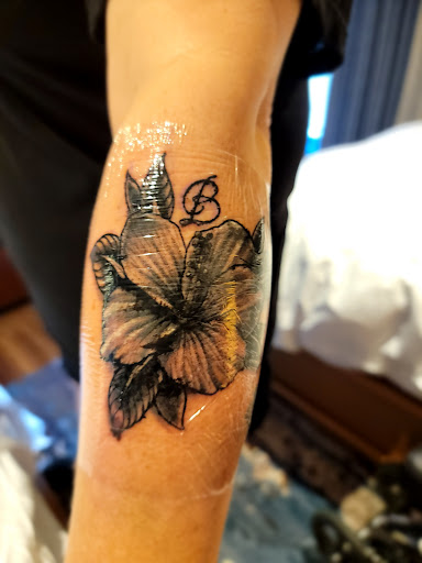 Explore song lyric tattoo ideas, creative tattoo ideas in Honolulu, available at Sacred Art Tattoo Waikiki