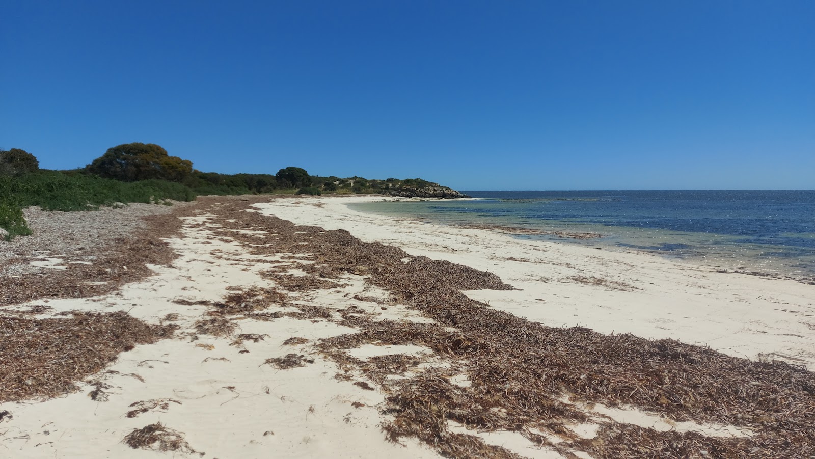 Foto von Little Anchorage Beach mit feiner beiger sand Oberfläche