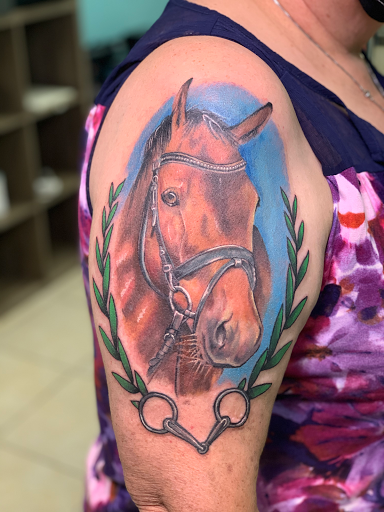 Explore ball python tattoo ideas, creative tattoo ideas in Ocala, available at The Tattoo Gallery of Ocala LLC