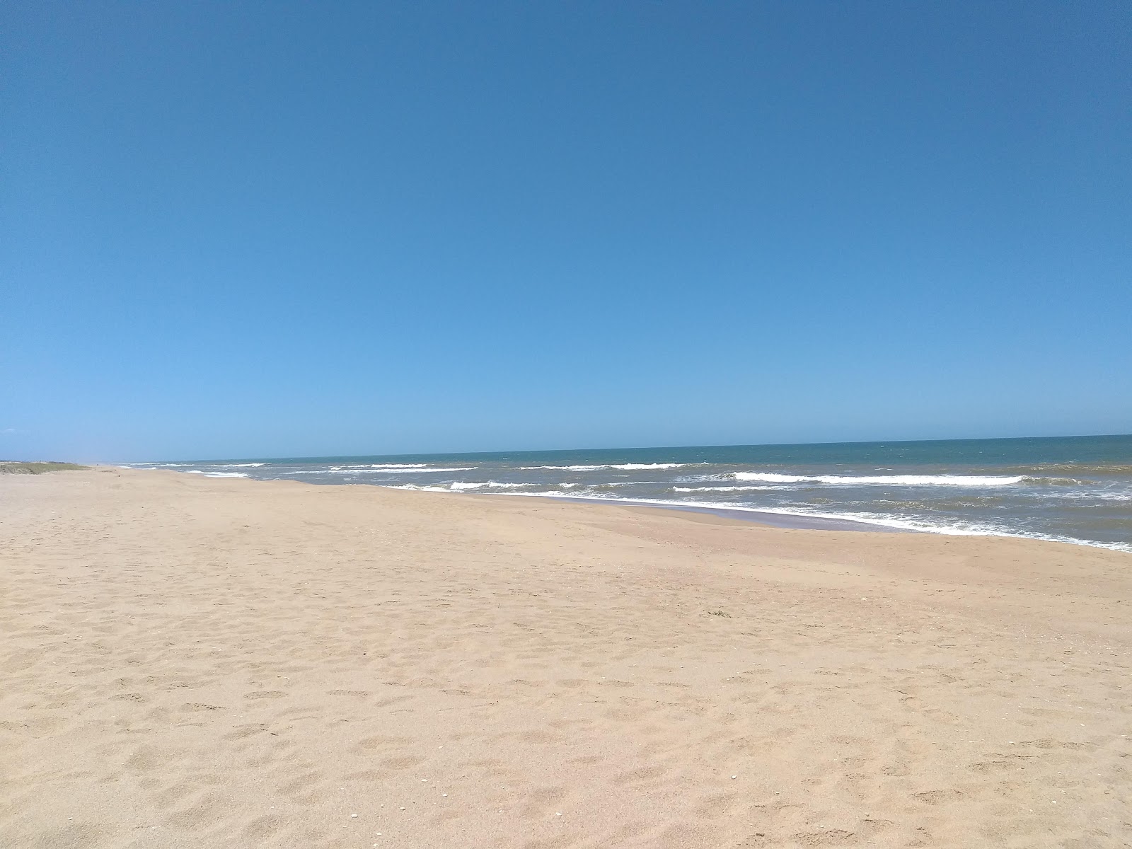 Escondida Beach的照片 带有碧绿色纯水表面