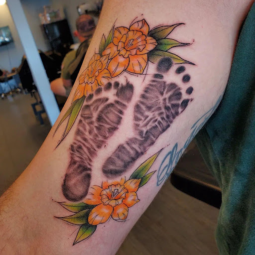Explore marathon running tattoo ideas, creative tattoo ideas in Palm Harbor, available at Angry Owl Tattoo and Piercing