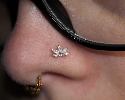 Find small tattoo ideas for mothers for your next unique tattoo in Buffalo at Moria Piercing and Jewelry