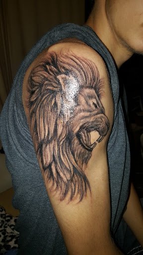 Explore simple neck tattoo ideas, creative tattoo ideas in Rollingstone, available at Tiger Lily Tattoo