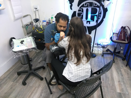 Explore dog bone tattoo ideas, creative tattoo ideas in Atlanta, available at Iron Palm Tattoos & Body Piercing Atlanta