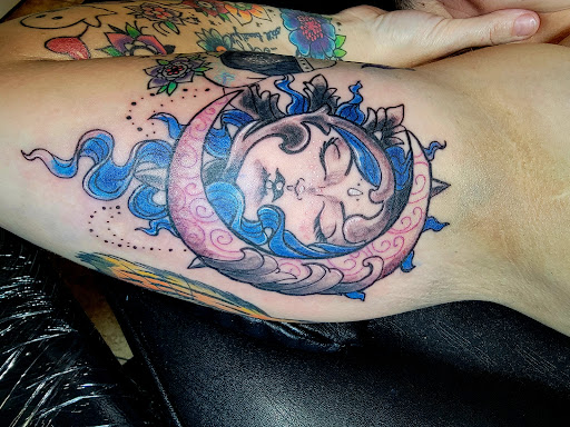 Explore outer thigh tattoo ideas, creative tattoo ideas in Onalaska, available at Rock Bottom Tattoo Studio