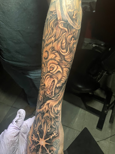 Explore tattoo ideas for a name cover up, creative tattoo ideas in Omaha, available at Eye Candy West Tattoo shop