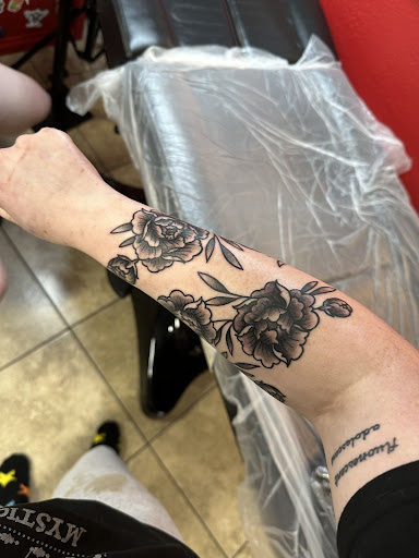 Explore ruby tattoo ideas, creative tattoo ideas in Katy, available at Artistic Impressions Tattoo Studio