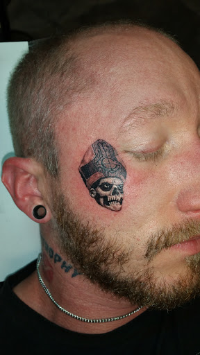 Explore rip neck tattoo ideas, creative tattoo ideas in Foley, available at Black Sheep Custom Tattoos and Piercings