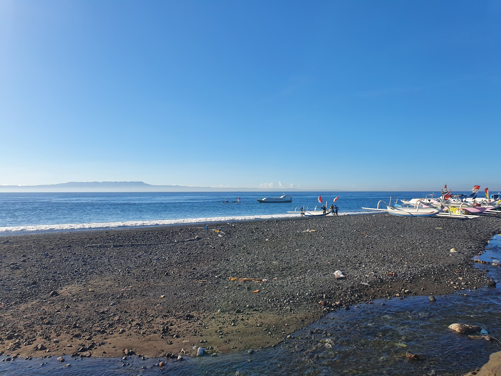 Fotografija Kusamba Segara Beach z modra čista voda površino