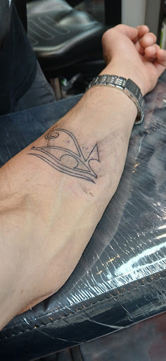 Explore barber pole tattoo ideas, creative tattoo ideas in Flint, available at Electric Chair Tattoo