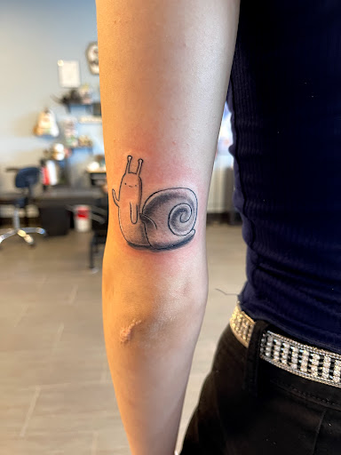 Explore tattoo ideas for men neck, creative tattoo ideas in Palm Harbor, available at Angry Owl Tattoo and Piercing
