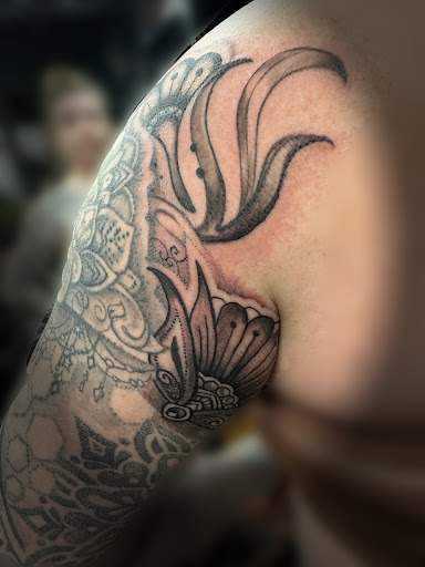 Explore red cardinal tattoo ideas, creative tattoo ideas in Eugene, available at Whiteaker Tattoo Collective