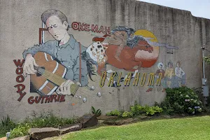 Woody Guthrie Mural and Statue image