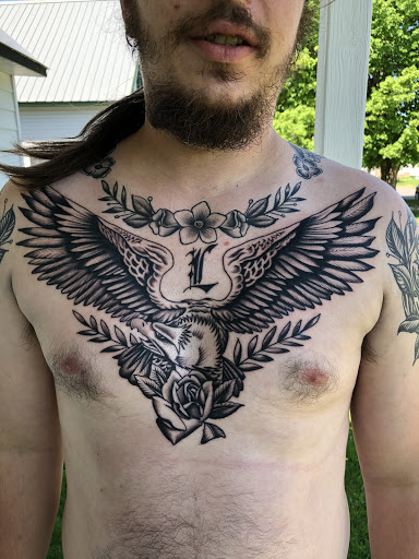 Explore red string of fate tattoo ideas, creative tattoo ideas in Ironwood, available at Iron Ink Tattoos