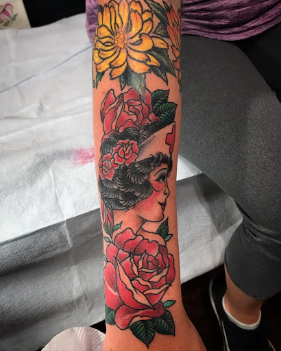 Explore tattoo flower ideas, creative tattoo ideas in Libertyville, available at Lucky Seven Tattoo