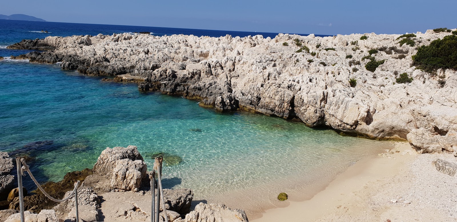 Photo of Alaties beach with turquoise pure water surface