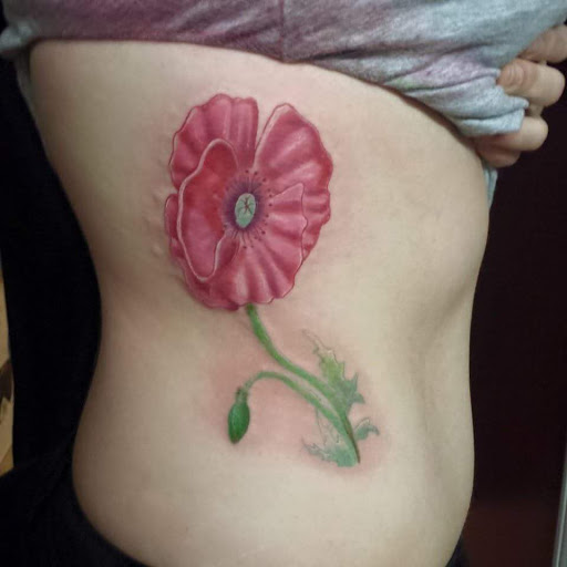 Explore flower tattoo cover up ideas, creative tattoo ideas in Rutherfordton, available at Wicked Needle