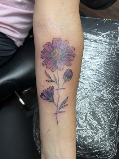 Explore ocean wave tattoo ideas, creative tattoo ideas in Dubuque, available at The Crows Nest
