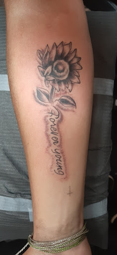 Explore twin tattoo ideas for mom, creative tattoo ideas in Charlottesville, available at Mystic Tattoo and Body Piercing