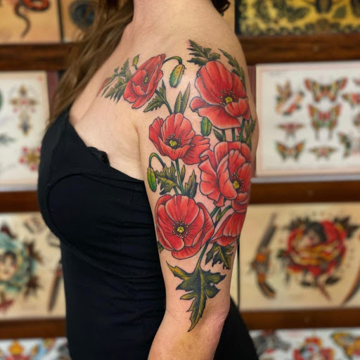 Find tattoo ideas between breast for your next unique tattoo in Wappingers Falls at Graceland Tattoo