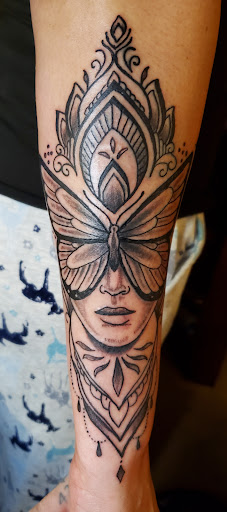 Find between breast tattoo ideas for your next unique tattoo in Inverness at The Perfect Spot Tattoos