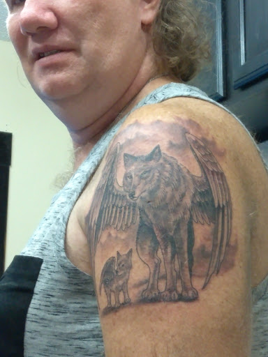 Find angel tattoo ideas for females for your next unique tattoo in Eureka at Primal Decor