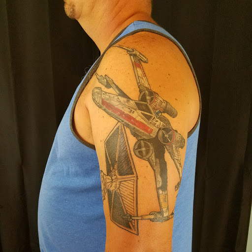 Explore skull and roses tattoo ideas, creative tattoo ideas in Newburgh, available at Shangri-Las Tattoo Emporium