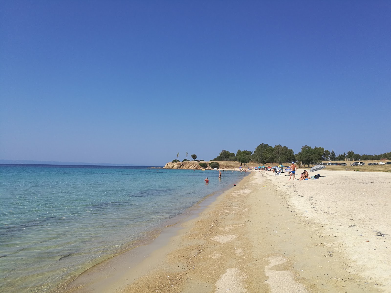 Photo of Agios Ioannis beach with blue pure water surface