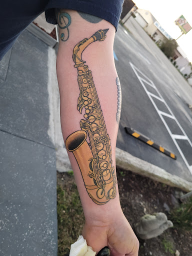 Explore mens behind ear tattoo ideas, creative tattoo ideas in Myrtle Beach, available at Elite Ink Tattoos of Myrtle Beach