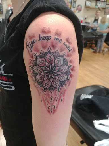 Explore colored tattoo ideas, creative tattoo ideas in Liberty, available at Dark Lotus Tattoo & Salon