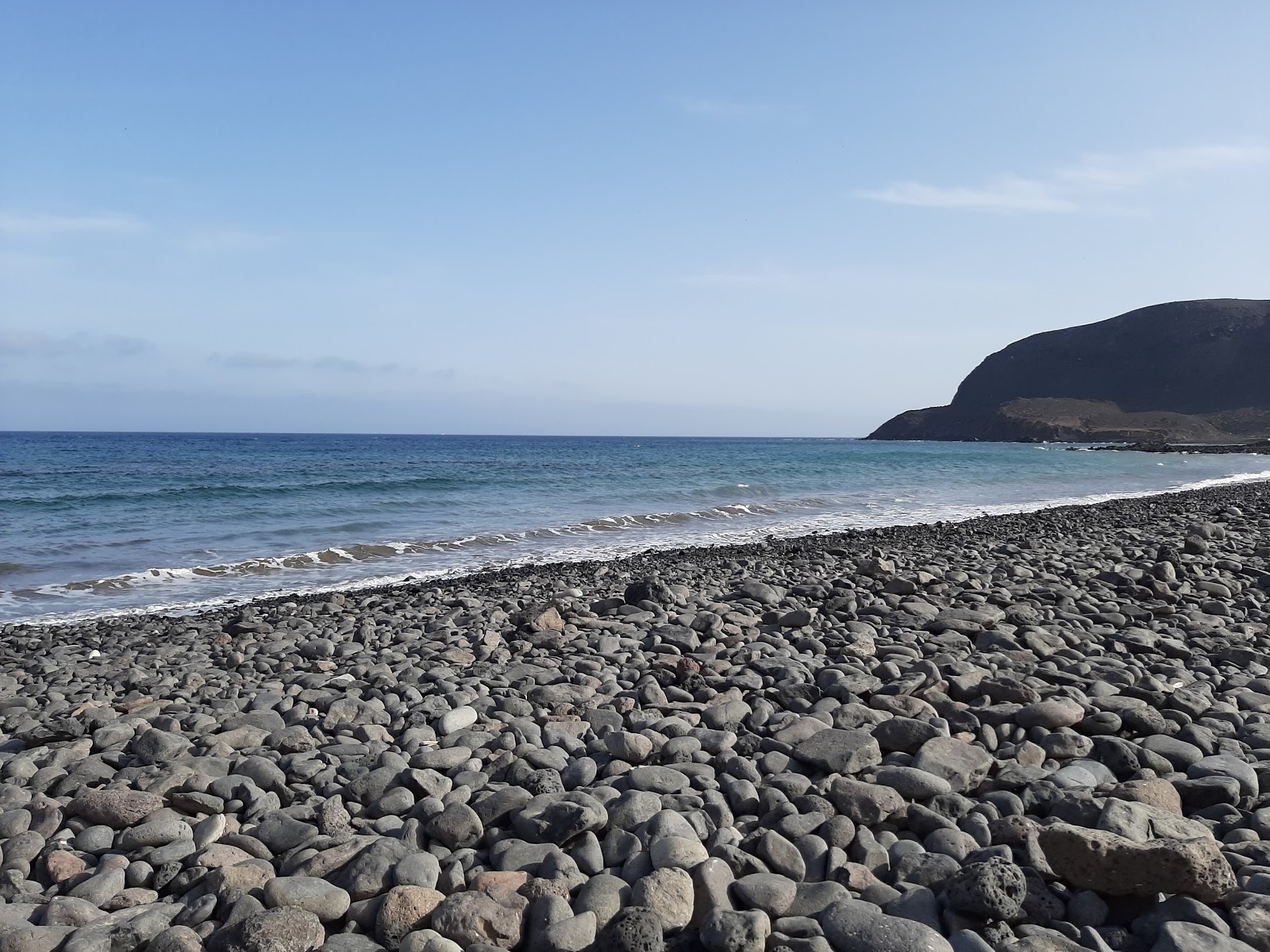 Foto de Playa Pozo Negro - lugar popular entre os apreciadores de relaxamento