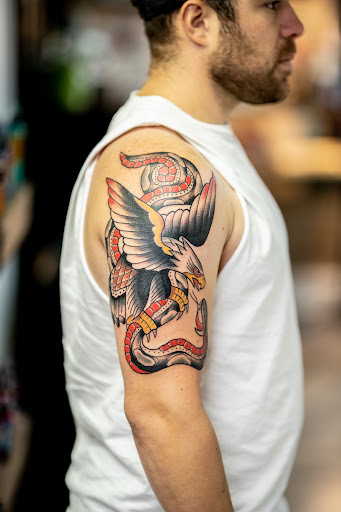 Explore dollar sign tattoo ideas, creative tattoo ideas in Leesville, available at Revolution Ink Tattoo and Art Gallery