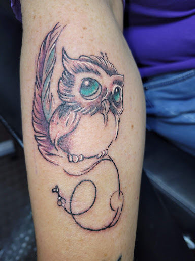 Explore gold tattoo ideas, creative tattoo ideas in Angola, available at Hoodlum Ink