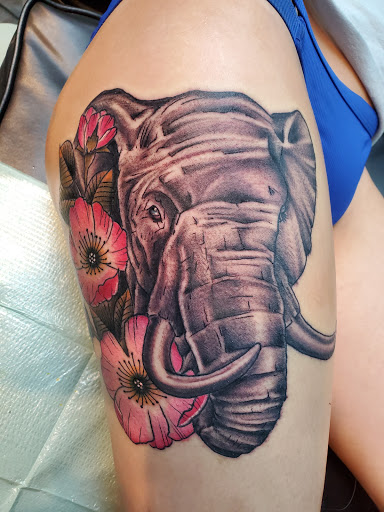 Explore memorial cross tattoo ideas, creative tattoo ideas in Sanford, available at Ink Ink Tattoos