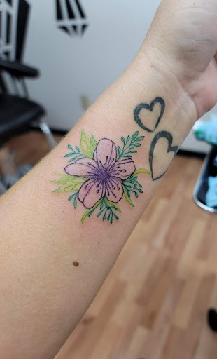 Explore half leg sleeve tattoo ideas, creative tattoo ideas in Benton, available at Spectrum Tattoo