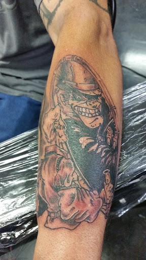 Explore gap filler tattoo background shading ideas, creative tattoo ideas in Hilliard, available at 22 Caliber Tattoo Mega Studio