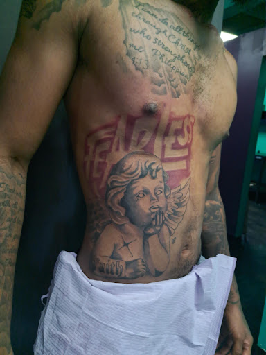 Explore middle finger tattoo ideas, creative tattoo ideas in Mobile, available at Boujie Tattoo & Body Piercing