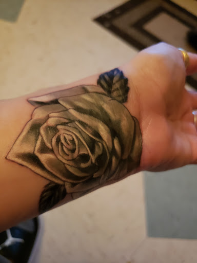 Explore ankle tattoo ideas for men, creative tattoo ideas in Newburgh, available at Ink Spill Tattoo