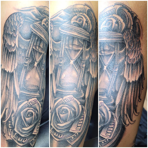 Explore arm sleeve tattoo ideas for men, creative tattoo ideas in Angola, available at Hoodlum Ink