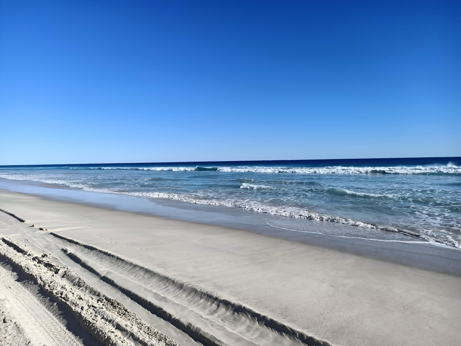 Fotografie cu South Beach cu o suprafață de nisip strălucitor