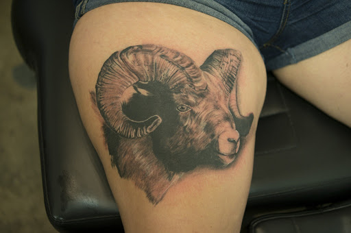 Find in between boob tattoo ideas for your next unique tattoo in Denison at Calypso Tattoo