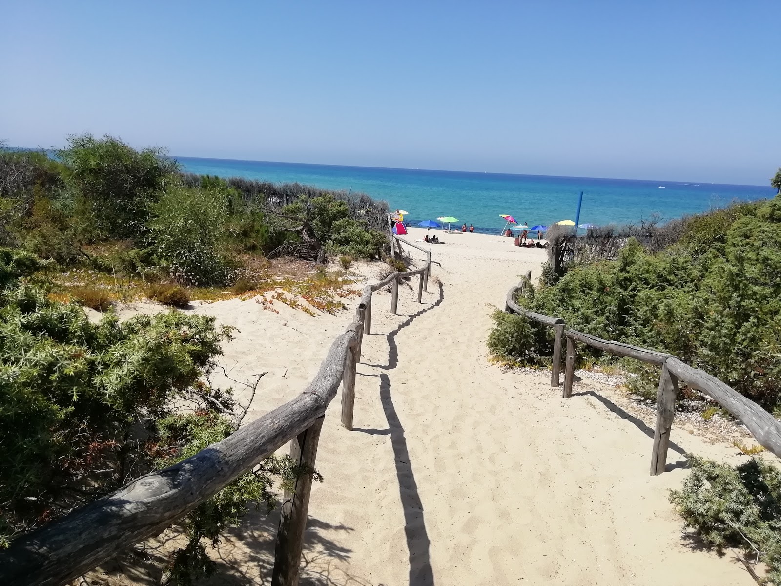 Photo of Junchi di Badesi beach with long straight shore