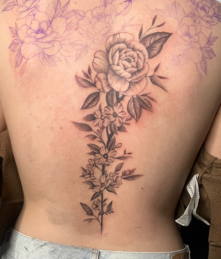 Explore throat tattoo ideas for males, creative tattoo ideas in Cadillac, available at Limitless Ink Tattoo Studio