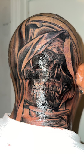 Explore halloween tattoo ideas for men, creative tattoo ideas in Orange, available at Ink Activitiez Tattoo