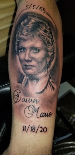 Explore tattoo ideas for guys calf, creative tattoo ideas in Angola, available at Hoodlum Ink