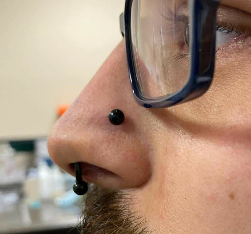 Explore barber pole tattoo ideas, creative tattoo ideas in Charleston, available at Exotic Impressions Body Piercing