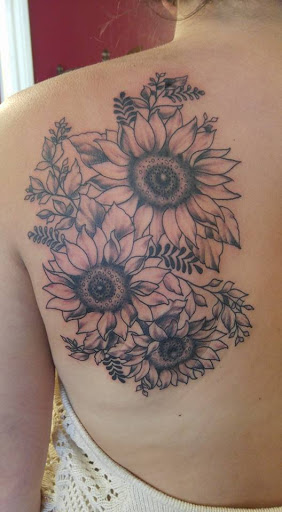 Explore koi fish sleeve tattoo ideas, creative tattoo ideas in Redding, available at The Salty Sloth Tattoo