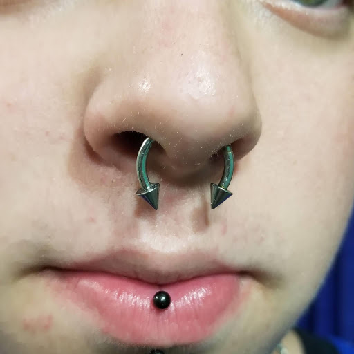 Explore black and white tattoo ideas, creative tattoo ideas in Louisburg, available at Purple Dot Piercings